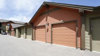 a row of garage doors on the side of a building